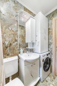 a bathroom with a sink and a washing machine at Prcanj Seaside Heaven in Prčanj +23 photos