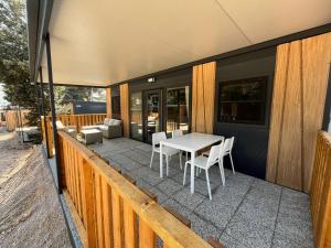 a patio with a table and chairs on a deck at Emil 8 in Pakoštane