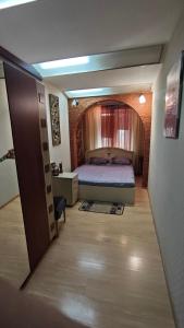 a bedroom with a bed in a room at Spacious apartment on Otakar Yarosh in Kharkiv