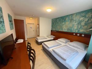 Krevet ili kreveti u jedinici u okviru objekta Kölner Hotel