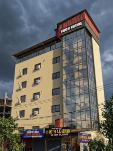 a large building with a lot of windows at hotel ak grand in Mangalore