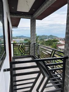 a balcony with a view of the city at T&J Harmony Lodge in Limbe