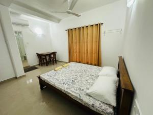 a bedroom with a bed in a room at La Margaritha Hotel & Banquet Hall in Udugampola