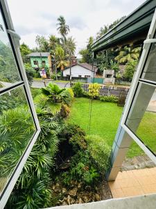 a view from the window of a house at La Margaritha Hotel & Banquet Hall in Udugampola
