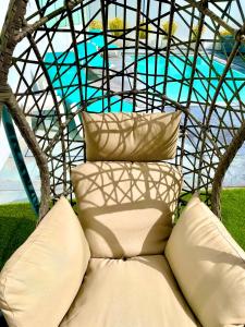 a bed with pillows sitting under a tent at Luxury Villa with Private Pool e Jacuzzi Year-Round a 25 min de Lisboa in Setúbal