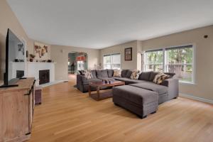 a living room with two couches and a television at Derby Dreams llc in Clarksville