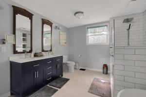 a bathroom with a sink and a toilet and a shower at Derby Dreams llc in Clarksville +28 photos