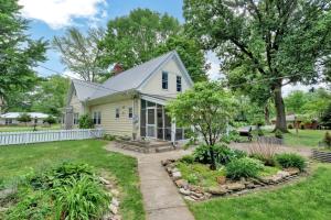 a white house with a garden in front of it at Derby Dreams llc in Clarksville
