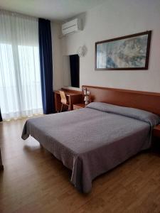 a bedroom with a large bed in a room at Hotel Silva Frontemare PARK & BEACH-PLACE INCLUDED in Lido di Jesolo +108 photos