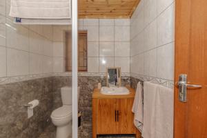 a bathroom with a toilet and a sink at Ruby on Hamilton in Windsor Park +44 photos