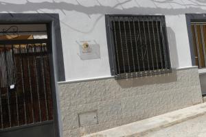 a building with a gate and a door at El patio de Marcos in La Recueja +24 photos