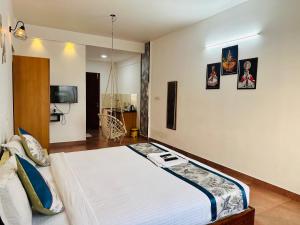 a bedroom with a large bed in a room at Melvet Residency in Cochin