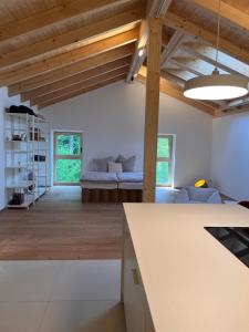 a living room with a couch and a table at Mitteraubach in Jandelsbrunn