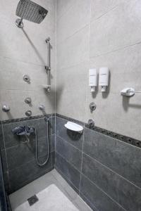 a bathroom with a shower and a sink at Casa Latina pyramids view in Cairo +56 photos