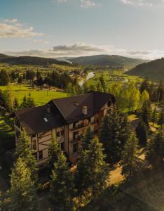 an aerial view of a house with a roof at Complex Turistic Le Baron Vatra Dornei in Vatra Dornei