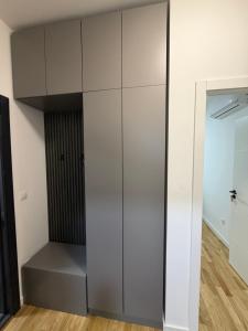 a large white cabinet in a room at Sarah Central City Apartment-Bar in Bar