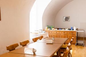 a dining room with a table and chairs at Zisterzienserstift Lilienfeld in Lilienfeld