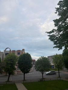 a car driving down a street with trees and buildings at Iris central Mangalia 2 bedroom apartment in Mangalia