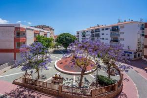 an aerial view of a park with trees and flowers at Bright & Spacious Apartment in Nerja Centre in Nerja