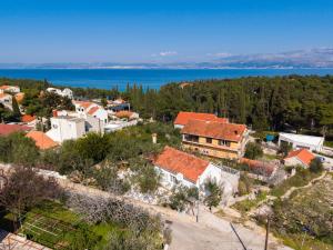 an aerial view of a town with a lake at Kuća Lucija in Supetar +4 photos