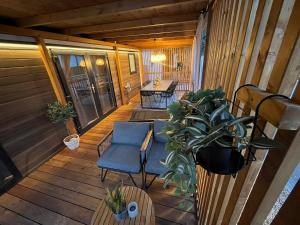 a porch with chairs and a table on a house at Max Mobile Home in Biograd na Moru