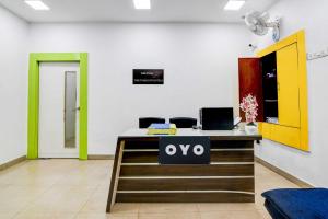 an office with a desk with a laptop on it at Hotel O The Diamond Palace in Kolkata +5 photos