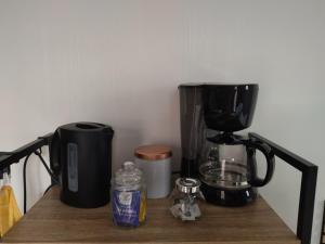 a counter with a coffee maker and a coffeemaker on it at Au coin des Lilas - studio 2 in Le Mans