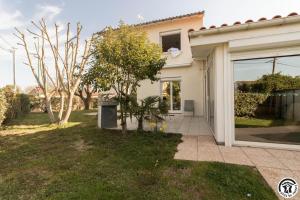 a house with a window and a yard at Maison venitia t5 in Aussonne +40 photos