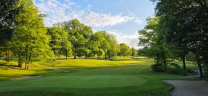 a view of a golf course with a green at Zimnitzblick in Haiden