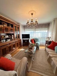 a living room with a couch and a table at Casa da Rapadoira in Laxoso de Abaixo