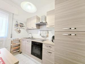 a kitchen with a sink and a stove at Lena Apartment Your Venice Gateway in Mestre in Mestre