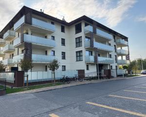an apartment building on the side of a street at Moon&Mori in Augustów