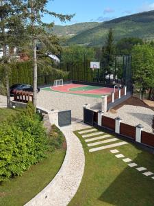 a basketball court with a basketball hoop at Mountain House LISINSKA ROSA in Brdo