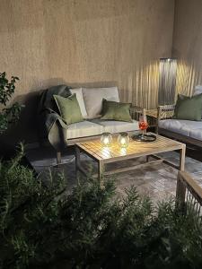 a living room with a couch and a coffee table at Sea Sky Villa with private pool in Costa Paradiso