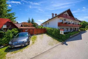 a car parked in front of a house at Frenkcottage 5 KM FROM THE AIRPORT- FREE TRANSPORTATION TO THE AIRPORT in Šenčur