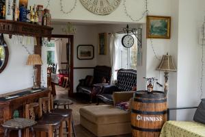 a living room filled with furniture and a barrel at Bella Vista in Carlingford