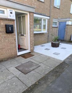 a front door of a brick building with a door at Corby Double & En-suite Rooms NN17 2LZ area Ideal Contractors Short & Long stays Opposite Lodge Park Leisure Center in Corby
