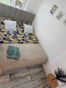 a bed in a small room with at Perfekt Place in Oświęcim