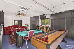 a room with a ping pong table and a couch at Spacious Villa Private Gameroom in Fallbrook