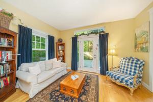 a living room with a white couch and a coffee table at Bella Mar in Nehalem