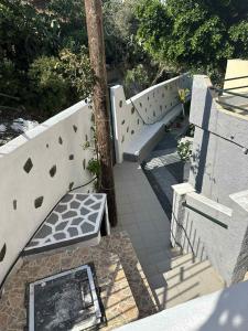 an overhead view of a stairway with a bench at Bazakos Luxury Kampi Beach Studio 2 in Fournoi