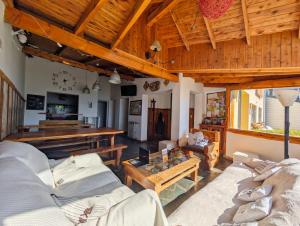 a living room with two couches and a table at Bariloche Hostel in San Carlos de Bariloche