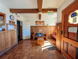 a living room with a couch and a table at Bariloche Hostel in San Carlos de Bariloche