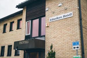 a brick building with a sign for a hotel at Edsviken Hotell in Stockholm