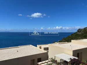 a view of the ocean from a building at Green Coast 244d - by Ale Investa in Palasë