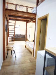 a room with a bed and a staircase in it at Villa Slnava in Banka