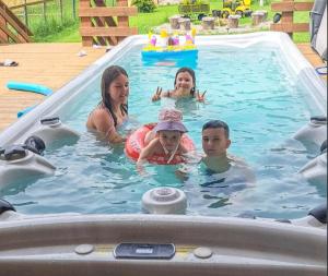 a group of people in a swimming pool at House Villa Ursus in Gerovo