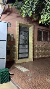 a door on the side of a house at Honey house in Marrakesh