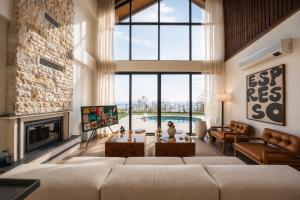 a living room with a couch and a fireplace at Voger Sapanca Lake View in Sapanca