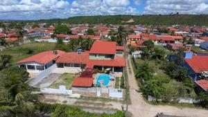 an aerial view of a house with red roofs at Pitimbu Beach House Rosi in Pitimbu
